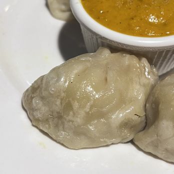 Himalayan Cuisine - 8 Pieces Chicken Momo...really overcooked or saved from the day before. - Indian Near Me - La Mesa, California