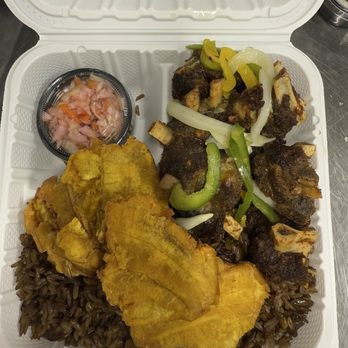 Dadou’s Haitian Restaurant - Fried Goat/Tassot Cabrit with Black Rice (Djon Djon) and Bunnan - Haitian Near Me - Middletown, New York Dadou’s Haitian Restaurant - Fried Goat/Tassot Cabrit with Black Rice (Djon Djon) and Bunnan - Haitian Near Me - Middletown, New York