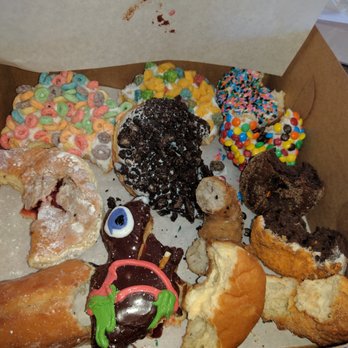 Voodoo Doughnut - Voodoo dozen minus 2 bites of each - Donuts Near Me - Austin, Texas Voodoo Doughnut - Voodoo dozen minus 2 bites of each - Donuts Near Me - Austin, Texas