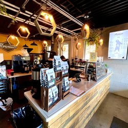 The shop, cozy spot with some seating outside