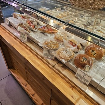 Tous Les Jours - A selection of baked goods on display - Coffee & Tea Near Me - Syracuse, New York