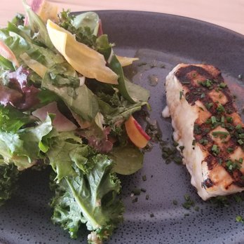 Ocean & Acre - $26 dollars for this small size of fish and salad. This picture shows the fish zoomed in. It's that small. - Seafood Near Me - Alpharetta, Georgia