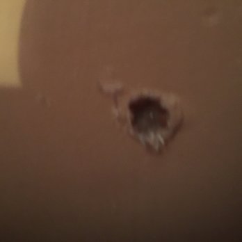 XFINITY - Hole in my living room wall from outside - Internet Service Providers Near Me