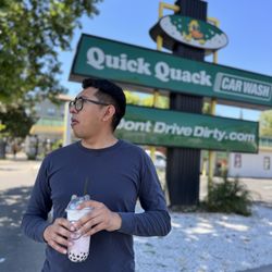 Quick Quack Car Wash - Advertisement and a happy customer