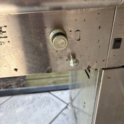 Collier Grill Cleaning - The outside is still dirty as you can see. He claimed he could get it looking brand new. Lies.