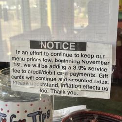 Don Juan's Mexican Restaurant - The notice on the plexiglass about the debit card fee. Not at eye level.