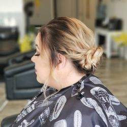 Beauty by Kate Taylor - A loose wedding updo.