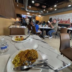 Curry NaanStop - Chicken Dum Biryani and seating area
