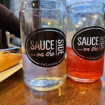 Sauce on the Side - The fold calzone with a drink on the side. - Salad Near Me - Indianapolis, Indiana Sauce on the Side - The fold calzone with a drink on the side. - Salad Near Me - Indianapolis, Indiana