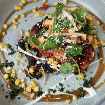 Elvira's DC Ranch - Mole negro glazed king salmon- Blue corn sope, cuitlacoche poblana rajas, jicama, tangy tamarind vinaigrette - Mexican Near Me - Scottsdale, Arizona