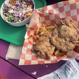 Buttermilk fried chicken thighs basket and cabbage salad
