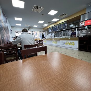 Stop-N-Go Gyros - a man sitting at a table - Mediterranean Near Me - Fort Worth, Texas Stop-N-Go Gyros - a man sitting at a table - Mediterranean Near Me - Fort Worth, Texas