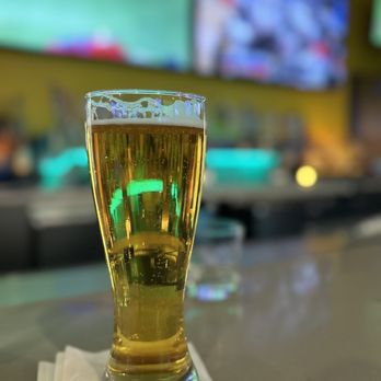 Buffalo Wild Wings - a glass of beer on a bar - Chicken Wings Near Me - Tempe, Arizona Buffalo Wild Wings - a glass of beer on a bar - Chicken Wings Near Me - Tempe, Arizona