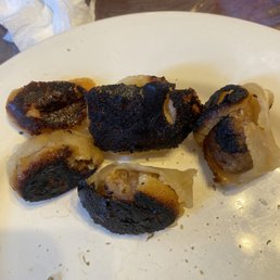 Pork dumplings. Burnt to a crisp. Pork dumplings. Burnt to a crisp.