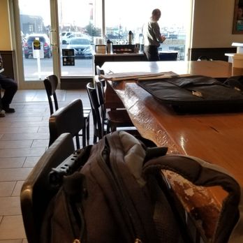 Starbucks - people sitting at tables in a coffee shop - Coffee & Tea Near Me - Calgary, Alberta Starbucks - people sitting at tables in a coffee shop - Coffee & Tea Near Me - Calgary, Alberta