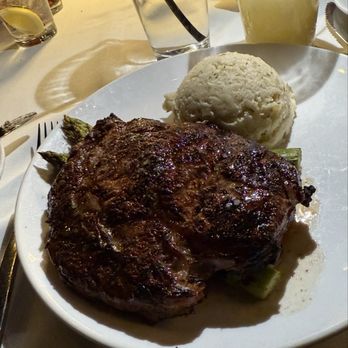 Baker Street Steakhouse - Ribeye with Roasted Garlic Whipped Potatoes and Marinated Portabella and Steamed Asparagus - Steakhouses Near Me - Fort Wayne, Indiana Baker Street Steakhouse - Ribeye with Roasted Garlic Whipped Potatoes and Marinated Portabella and Steamed Asparagus - Steakhouses Near Me - Fort Wayne, Indiana