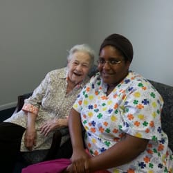 SYNERGY HomeCare - Happy Client With Her Caregiver