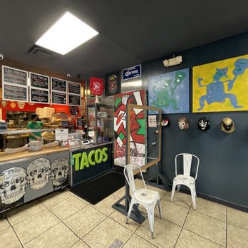 Taco Cantina - Order counter, waiting area and wall artwork. - Mexican Near Me - Smyrna, Georgia