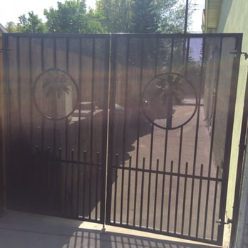 Ruiz's Construction & Landscaping - Awesome new custom wrought iron gates! Design and color (dark bronze) chosen by us! So cool! - Landscaping Near Me - Covina, California Ruiz's Construction & Landscaping - Awesome new custom wrought iron gates! Design and color (dark bronze) chosen by us! So cool! - Landscaping Near Me - Covina, California