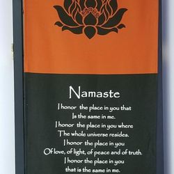 Reflexology and Beyond - Namaste backdrop behind heated table