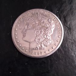 The Mobile Coin Shop - A 1885 cc morgan silver dollar  in good condition
