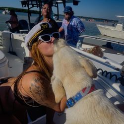 Skirtchaser Fishing Charters - Boat and puppy