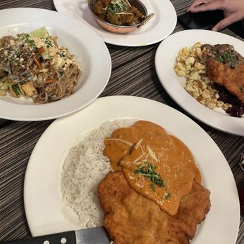 Paramjit's Kitchen - From left to right: Pad Thai, Beef Vindaloo, Hunter's Schnitzel Bottom: Butter Chicken Schnitzel - Indian Near Me - Revelstoke, British Columbia