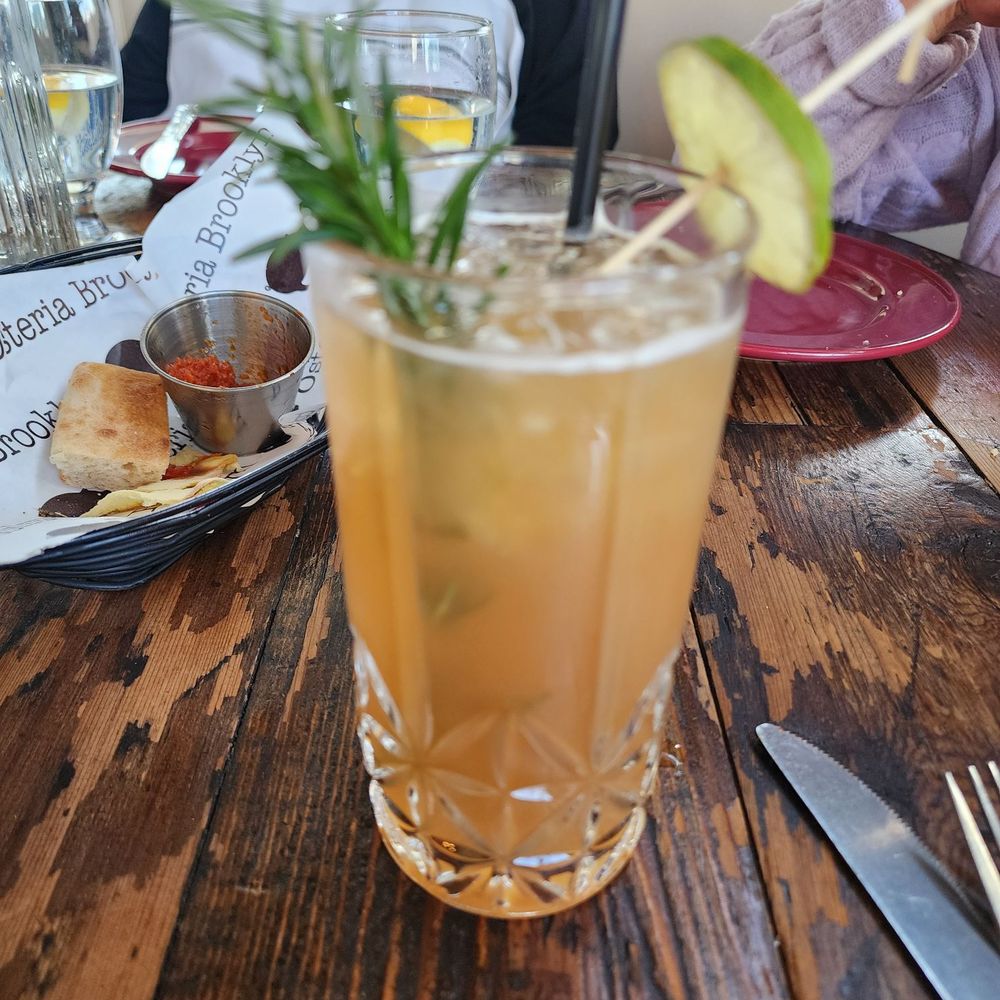 Osteria Brooklyn - Frate Scalzo (rye whiskey, pinot grigio, orange blossom tea, lemon juice, rosemary sprig. - Italian Near Me - Queens, New York