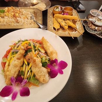 Siam Nara - Sunrise Salad with chicken satay and crab fried rice in the background - Thai Near Me - San Diego, California Siam Nara - Sunrise Salad with chicken satay and crab fried rice in the background - Thai Near Me - San Diego, California