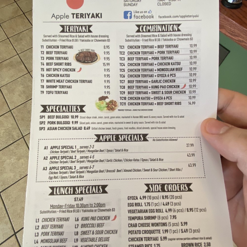 Apple Teriyaki - a person holding a menu - Japanese Near Me - Tacoma, Washington