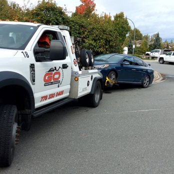 Go Towing & Recovery - Towing a vehicle with a broken engine back to the langley dealership - Towing Near Me - Langley Township, British Columbia Go Towing & Recovery - Towing a vehicle with a broken engine back to the langley dealership - Towing Near Me - Langley Township, British Columbia