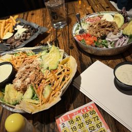 Chefs salads and tortilla salad. In the back is the filet mignon bites Chefs salads and tortilla salad. In the back is the filet mignon bites