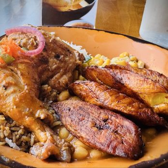 Baobab Fare - Chiken Kumuhana with spicy rice and coconut rice , both were amazing - Coffee & Tea Near Me - Detroit, Michigan