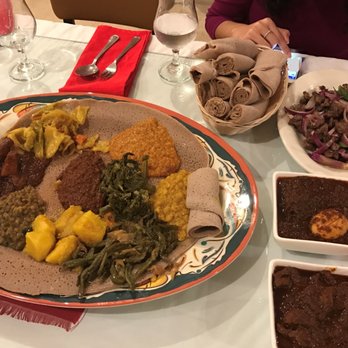 Addis Ababa - Ethiopian Restaurant - Vegetarian platter, Lamb Tibs, Doro Wat chicken, and lamb curry with lots of injera. - Ethiopian Near Me - Rochester, New York Addis Ababa - Ethiopian Restaurant - Vegetarian platter, Lamb Tibs, Doro Wat chicken, and lamb curry with lots of injera. - Ethiopian Near Me - Rochester, New York