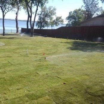 Tex Turf Sod - a sprinkler spraying water on a lawn - Landscaping Near Me - North Richland Hills, Texas Tex Turf Sod - a sprinkler spraying water on a lawn - Landscaping Near Me - North Richland Hills, Texas