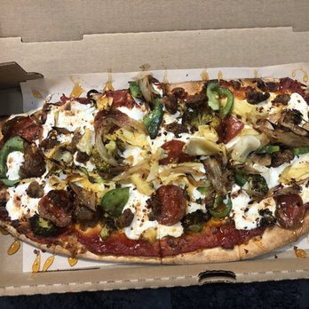 The Pizza Trust - Red sauce, fresh mozz, sausage, pepperoni, artichokes, broccoli, green peppers, and caramelized shallots topped off with hot honey drizzle - Pizza Near Me - Baltimore, Maryland
