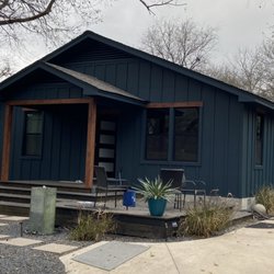 Titan Siding, Windows and Exteriors - James Hardie Battan & Board with stained trim for accent