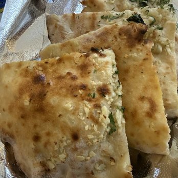 Kathmandu Cuisine - Garlic naan - like a cross between naan and focaccia - Himalayan/Nepalese Near Me - Los Altos, California Kathmandu Cuisine - Garlic naan - like a cross between naan and focaccia - Himalayan/Nepalese Near Me - Los Altos, California