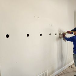 AIRLOCK Insulation - this is an interior retrofit. we are drilling and dense-packing cellulose insulation into the wall cavities with a tube using air pressure.