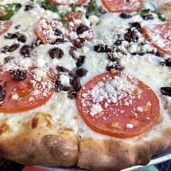 Siri's Gourmet Burgers & Pizza - Greek pizza, spinach on one side.