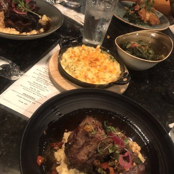 Lucille's - Oxtail and Grits, Yardbird, Mac & Cheese, and Braised Collard Green. - New American Near Me - Houston, Texas