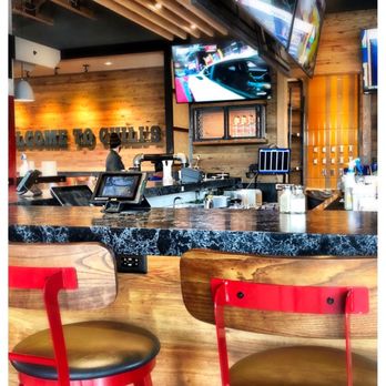 Chili's - Bar seating is available with multiple large screen TVs. - Tex-Mex Near Me - Spring Hill, Tennessee Chili's - Bar seating is available with multiple large screen TVs. - Tex-Mex Near Me - Spring Hill, Tennessee