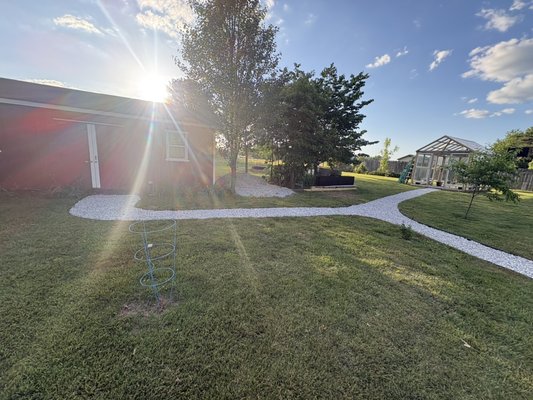 gravel pathways - The pathway was constructed to be 3 feet wide. The backyard section measured 86 feet in length, while the front yard section was 40 feet long. We utilized 6 tons of gravel for both areas and installed heavy-duty fabric and edging on both sides. gravel pathways - The pathway was constructed to be 3 feet wide. The backyard section measured 86 feet in length, while the front yard section was 40 feet long. We utilized 6 tons of gravel for both areas and installed heavy-duty fabric and edging on both sides.