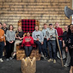 Dungeon Throwers - Capturing the moment at the Dungeon Throne photo wall at Dungeon Throwers, Madison's top axe throwing spot.