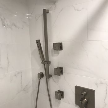 Waatti Contracting - a shower head and shower faucet - General Contractors Near Me - Wilmington, North Carolina