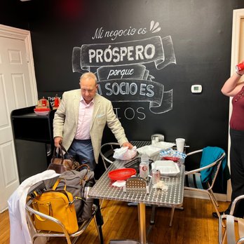 Arepa House - a man sitting at a table in front of a chalkboard - Venezuelan Near Me - Harrisburg, Pennsylvania Arepa House - a man sitting at a table in front of a chalkboard - Venezuelan Near Me - Harrisburg, Pennsylvania
