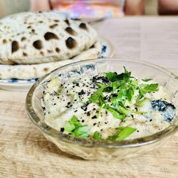 Ladino - Pita in the background with the charred eggplant.