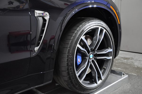 Photo of Immaculate Reflections Auto Detailing - Brentwood, CA, US. BMW X5M received a 2 step paint correction and CQuartz Professional ceramic coating, including removing and coating wheels & brake calipers