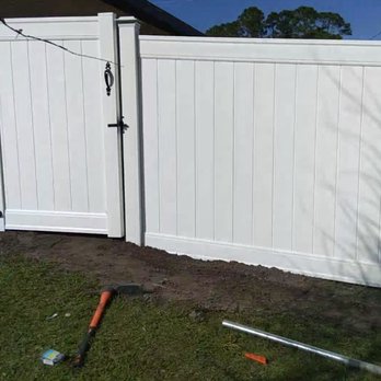 Bayba's Home Improvement - a white fence and a shovel - Handyman Near Me Bayba's Home Improvement - a white fence and a shovel - Handyman Near Me