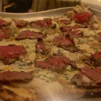 Mistral - Thin crust pizza topped with tenderloin, mashed potato, and truffle oil - French Near Me - Boston, Massachusetts Mistral - Thin crust pizza topped with tenderloin, mashed potato, and truffle oil - French Near Me - Boston, Massachusetts